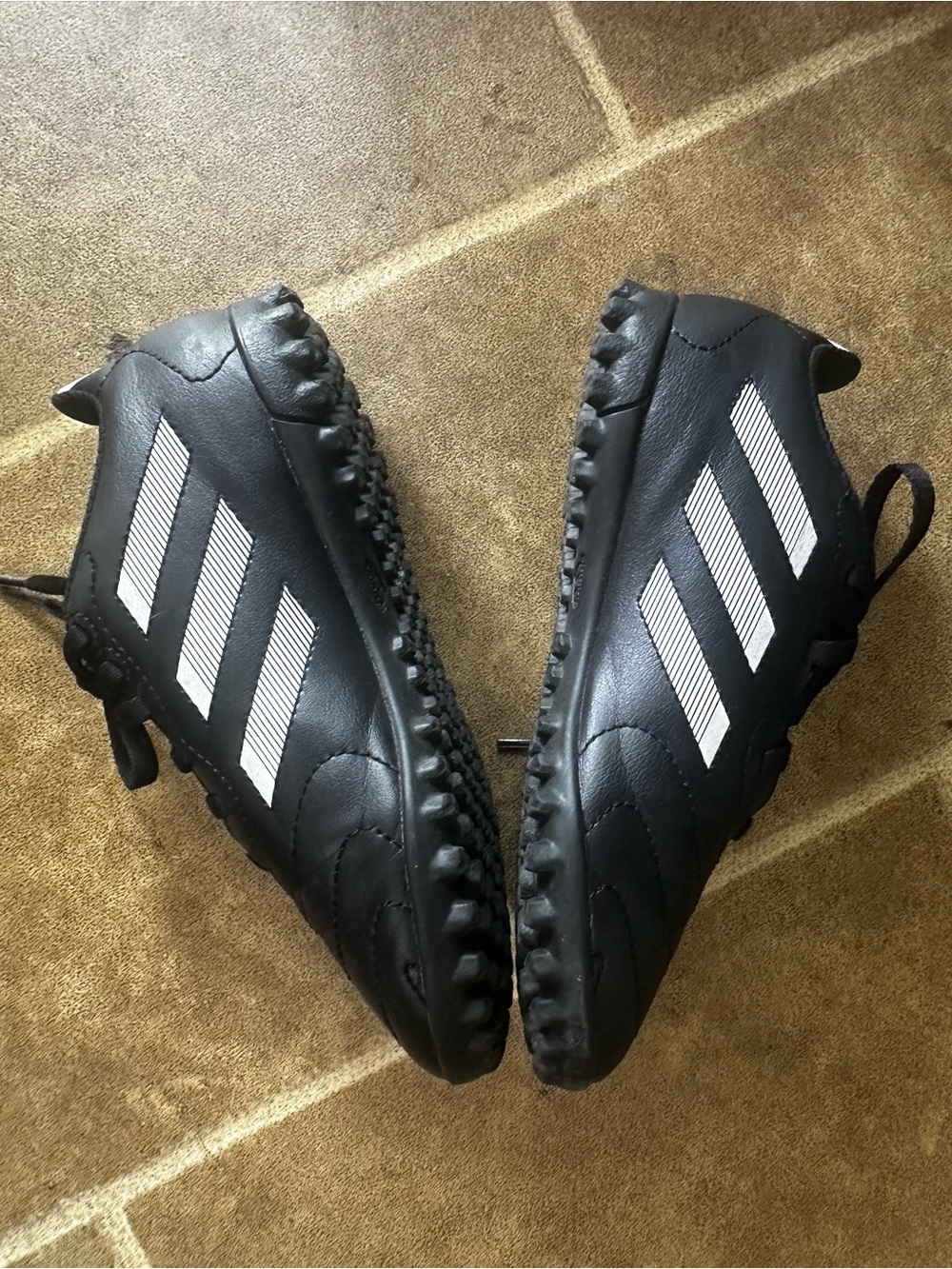 adidas Black Athletic Cleats with White Stripe Accents